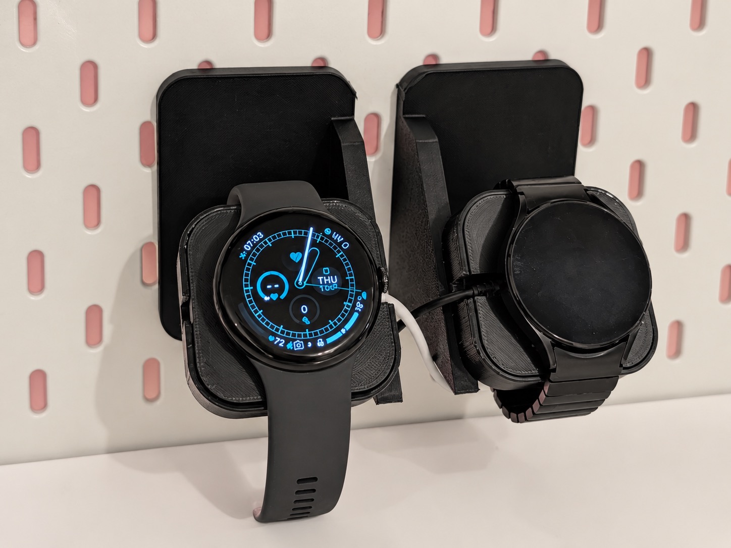 Real photo of the JDC Duo printed watch docks fitted to an IKEA SKÅDIS pegboard